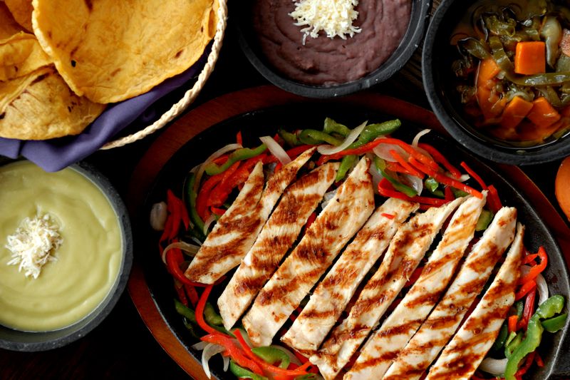 Grilled chicken caesar wrap in spinach tortilla